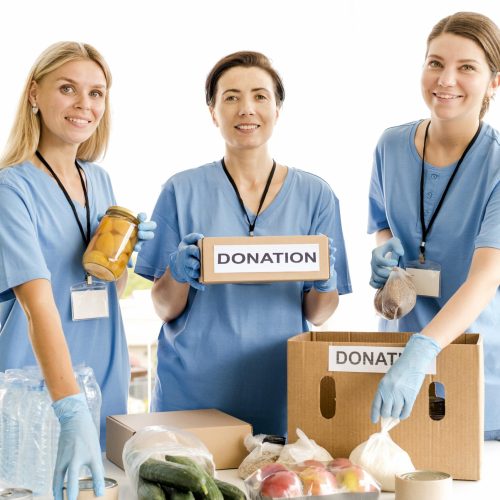 people-preparing-boxes-with-provisions-food-day
